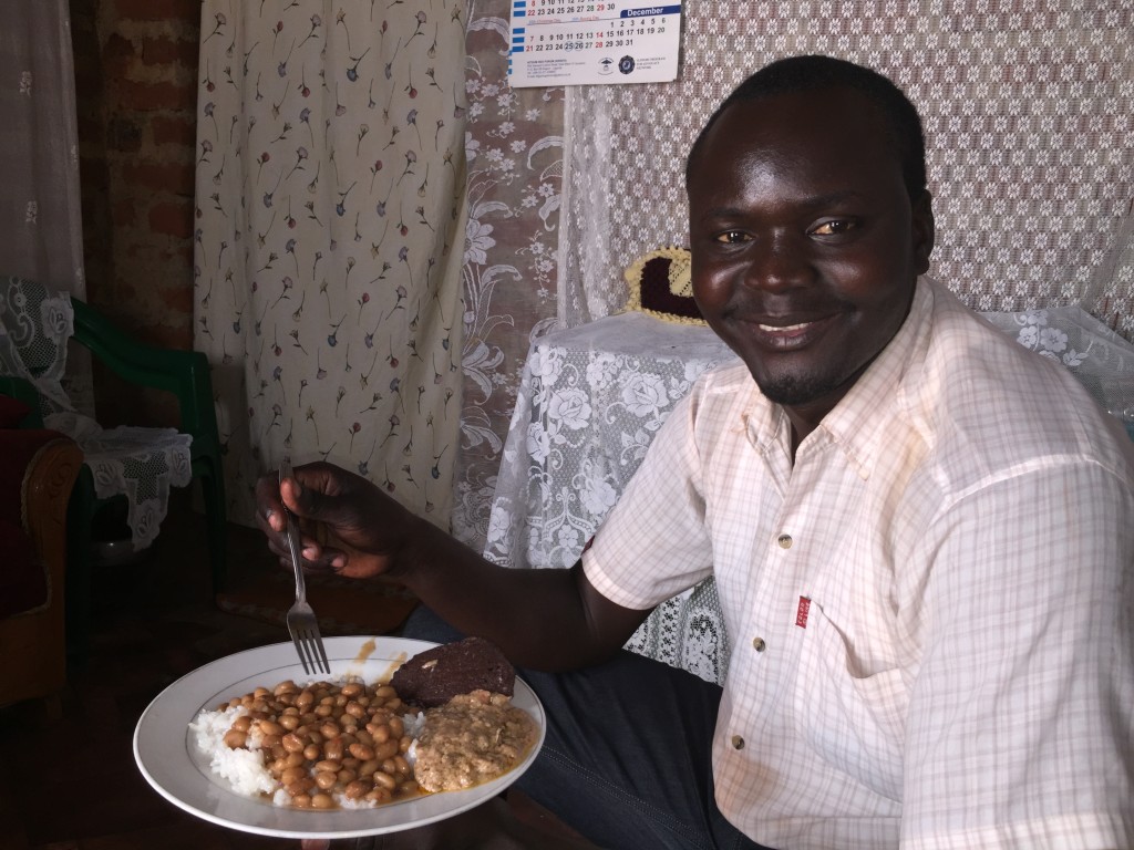 George at home, eating with the visitor. 