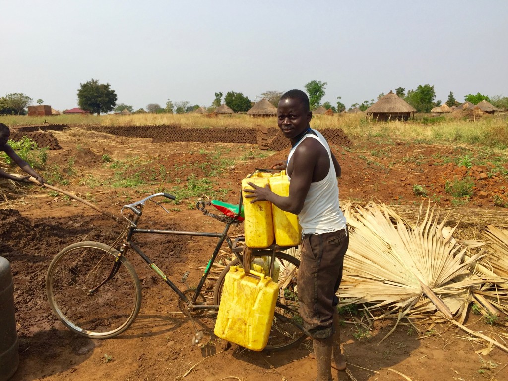 This was probably his tenth trip to the borehole to get water to for the brick making. 