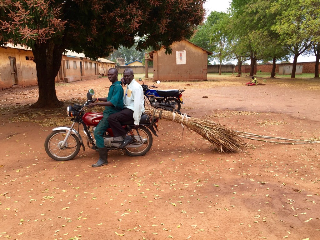 Two of the actors are bringing materials to make one of the props. 