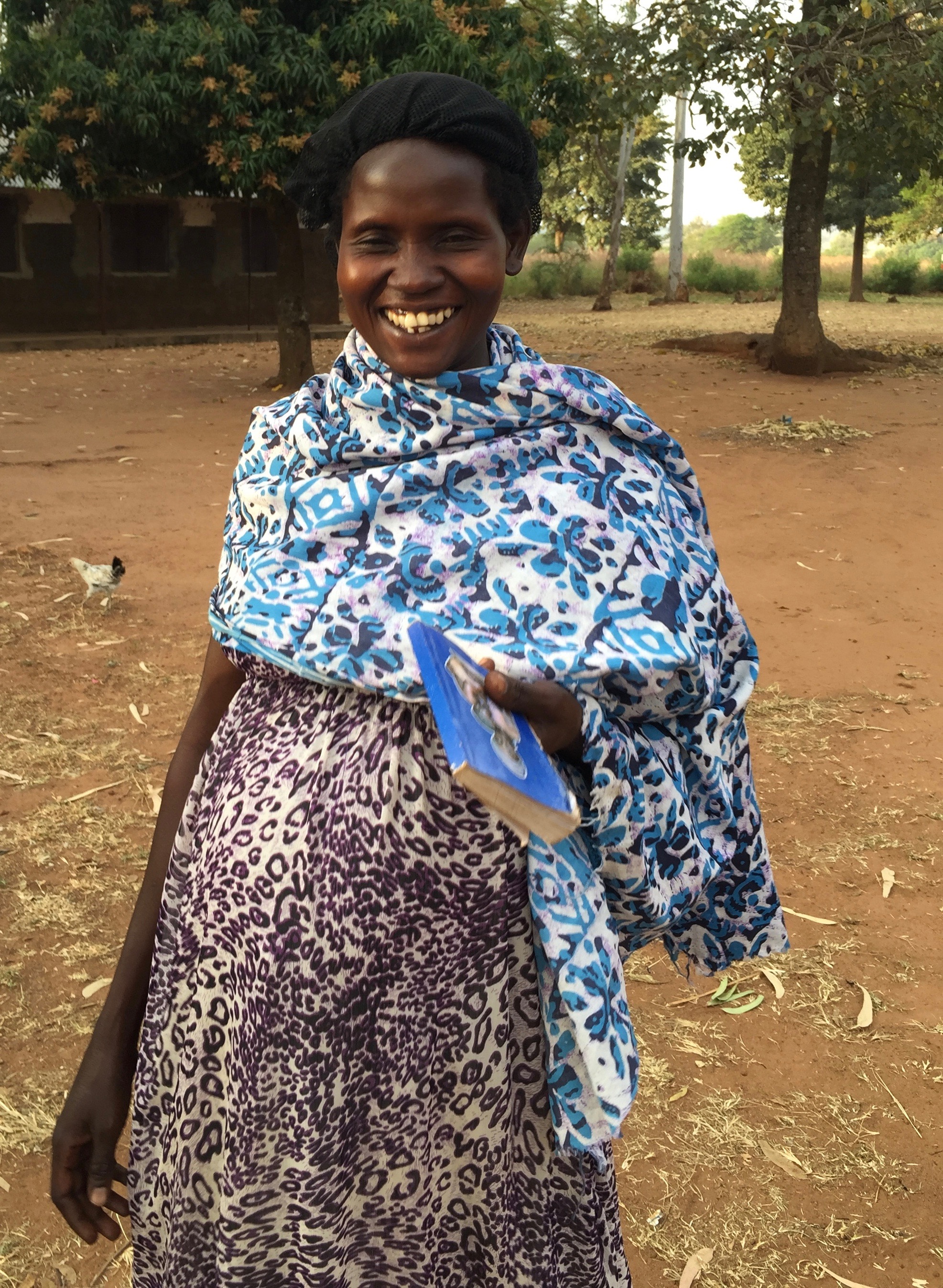 Christine, wife of Oyet Tommy, after morning mass.