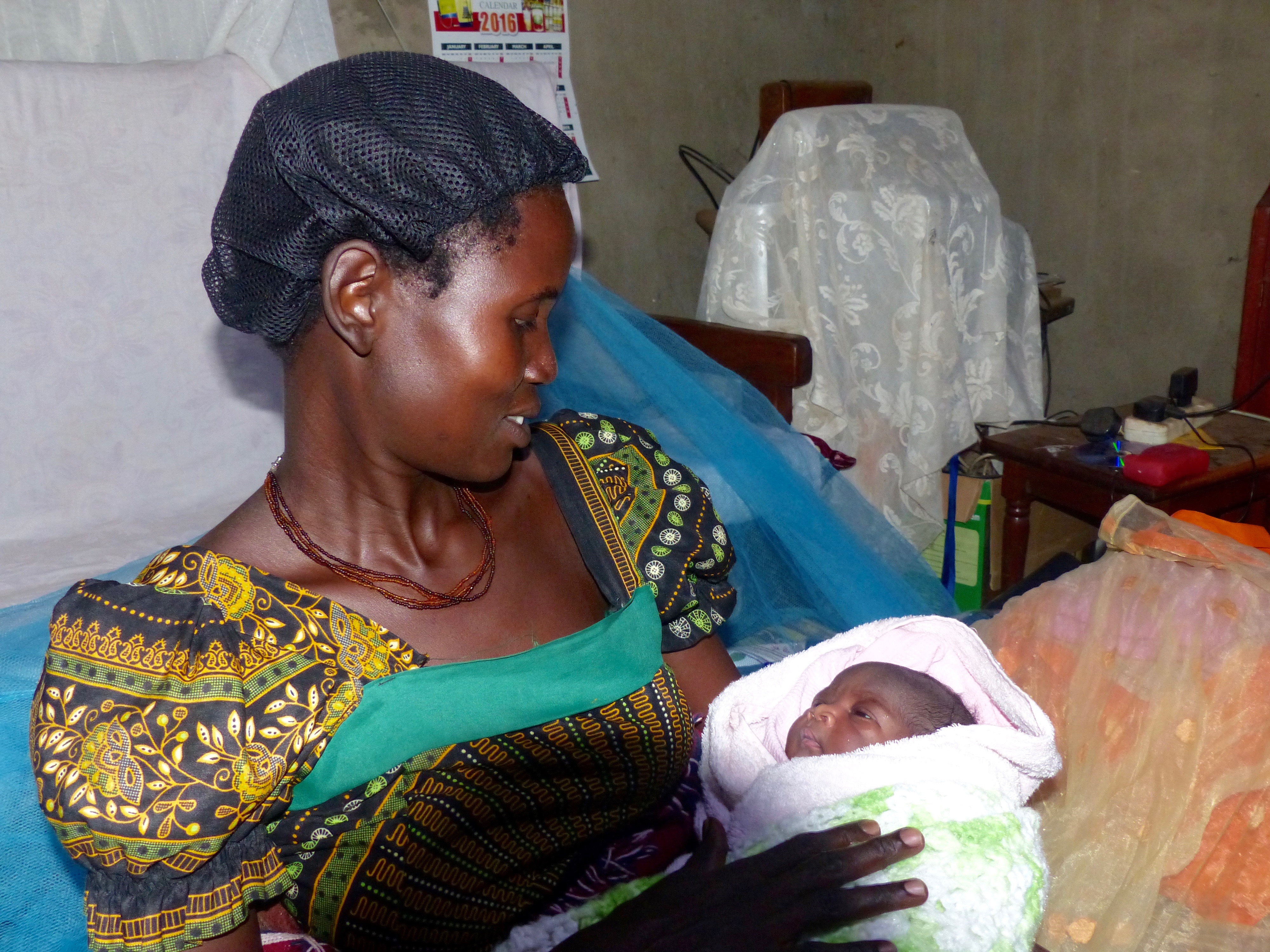Christine, a loving mother, with her one day old baby girl, Kati