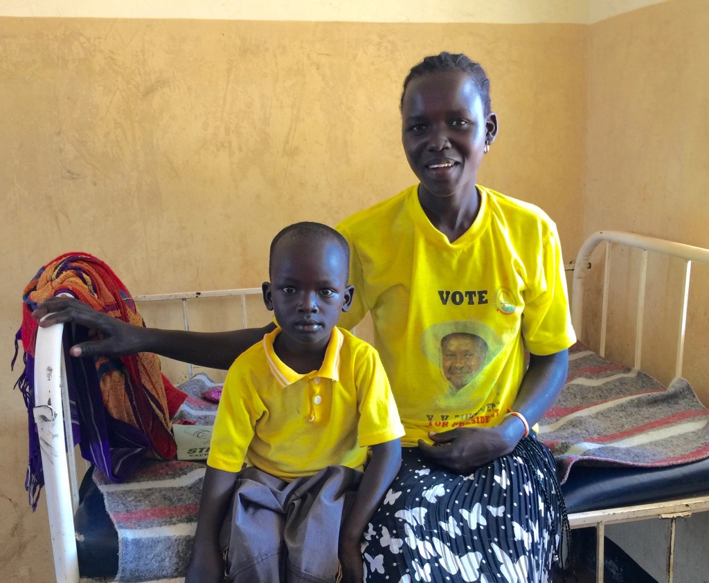 Mother holding her malaria stricken child.