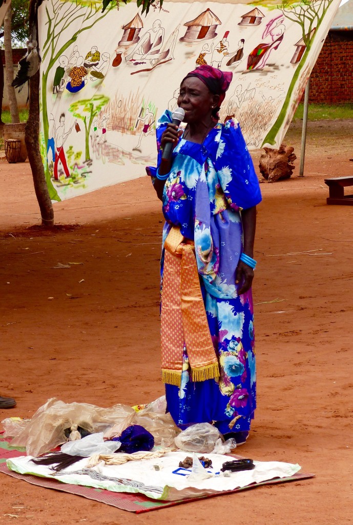 A woman elder exhibits and talks about Acoli artifacts she kept hidden from the rebels during the 24 year war. 